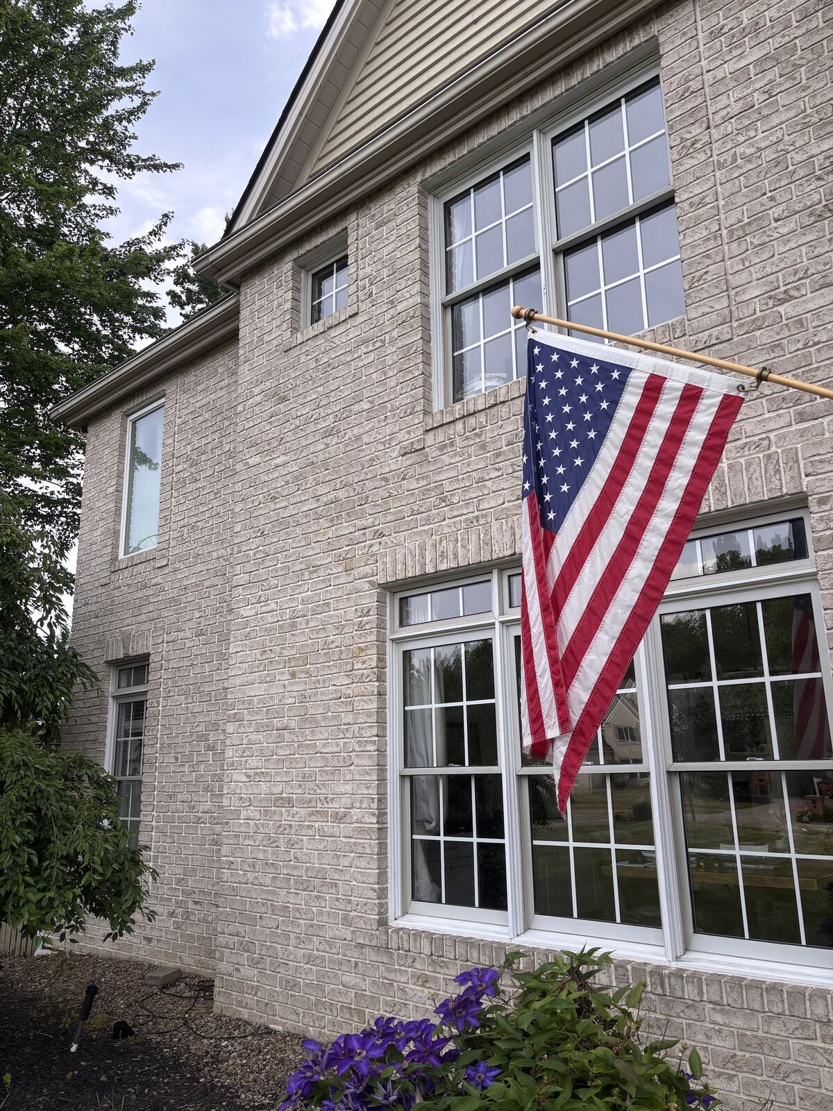 Clean windows on a brick home, streak-free